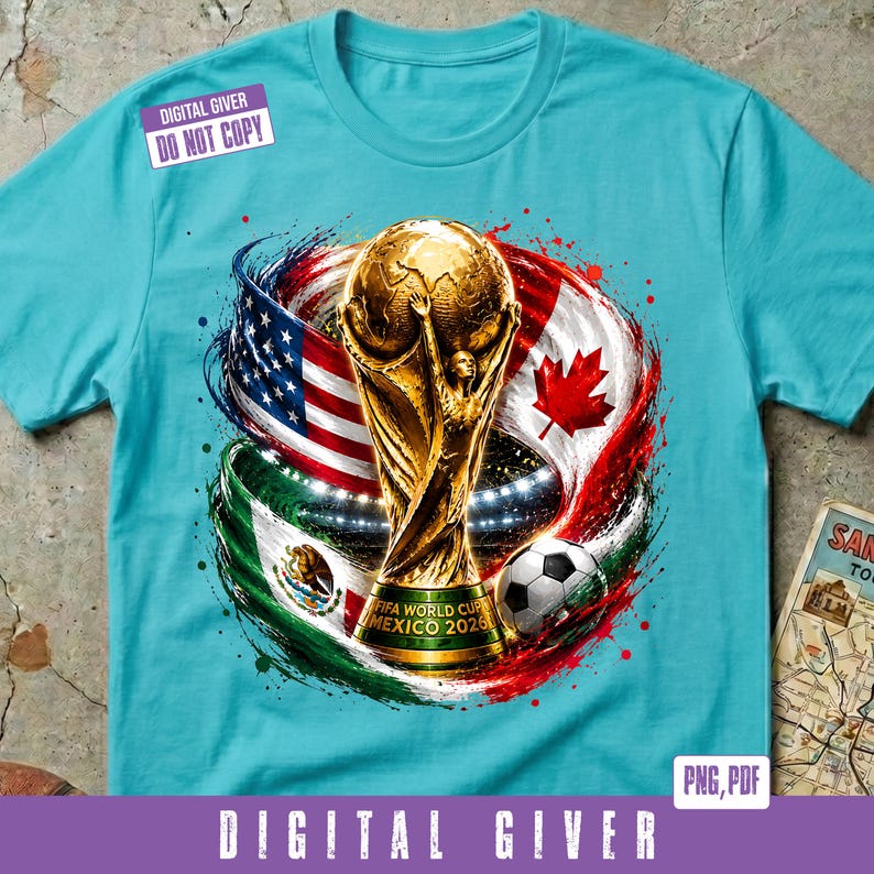 May include: A turquoise t-shirt featuring a graphic of the FIFA World Cup trophy, a soccer ball, and the flags of the United States, Canada, and Mexico. The trophy base includes the text "MEXICO 2026". A "DIGITAL GIVER DO NOT COPY" label is visible.