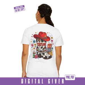 May include: A white t-shirt featuring a back graphic of a cow-print cowboy boot topped with a red cowboy hat. The boot displays the text TAYLOR and a beaded bracelet reading I KNEW IT I KNEW YOU, surrounded by flowers, stars, and blocks.