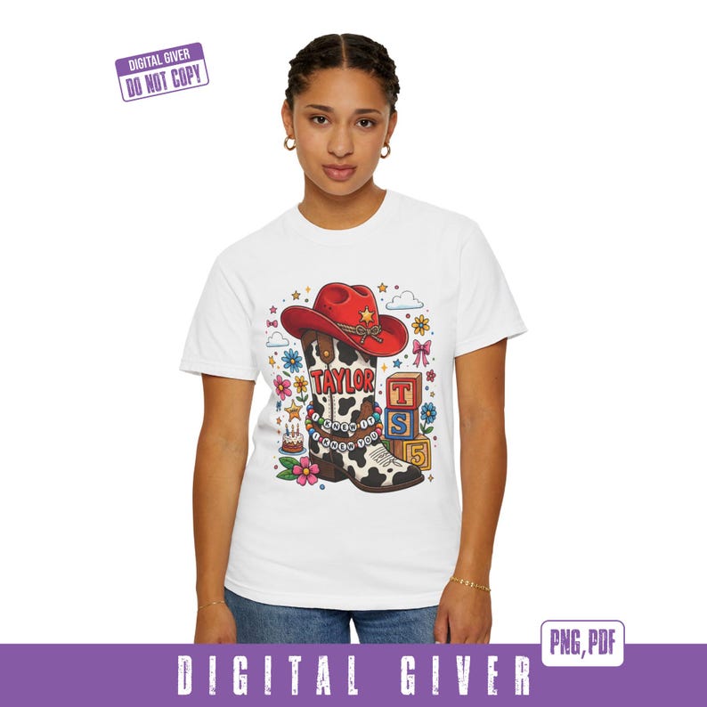 May include: A white short-sleeved t-shirt featuring a graphic of a cow-print cowboy boot with a red hat, a beaded bracelet with the text I KNEW IT I KNEW YOU, the name TAYLOR, colorful flowers, a small birthday cake, and stacked alphabet blocks.