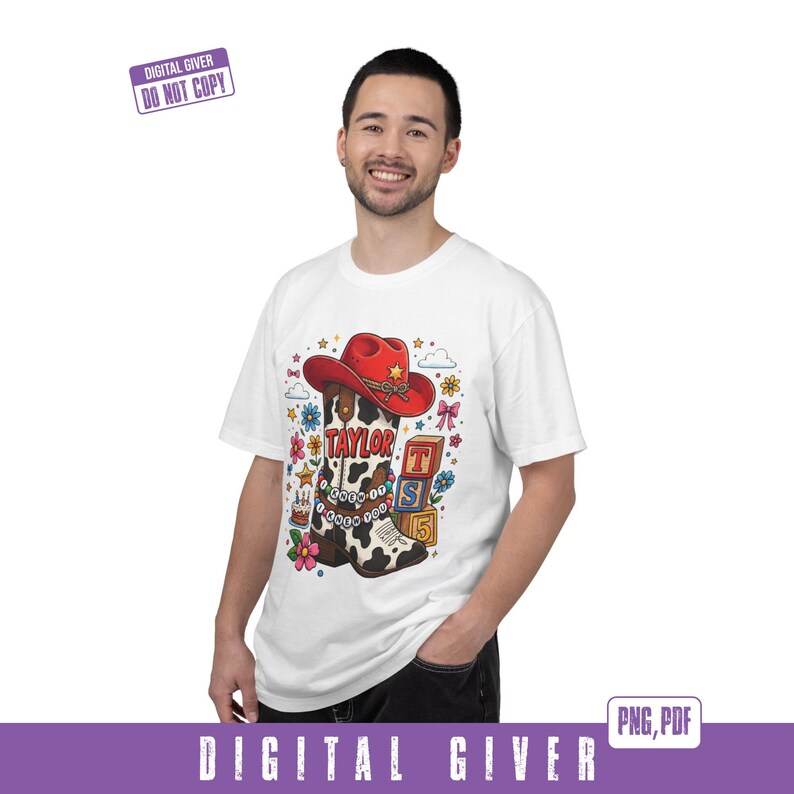 May include: A white t-shirt featuring a graphic of a cow-print cowboy boot topped with a red cowboy hat. The boot is decorated with beads and the text "TAYLOR" and "KNEW IT KNEW YOU". Nearby are colorful flowers, stars, and blocks labeled "T", "S", and "5".