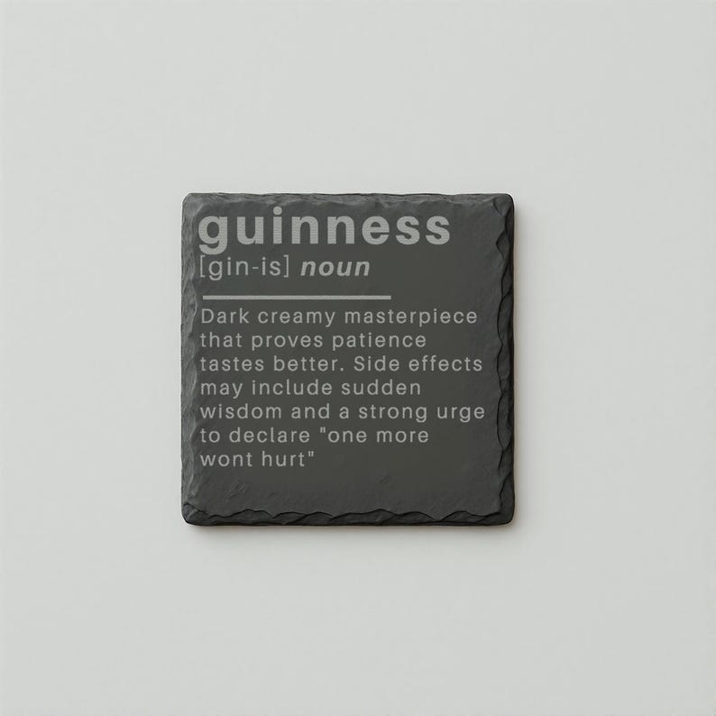 May include: A square, dark gray slate coaster with the word "guinness" in a light gray font. Below the word is a definition that describes the drink and its effects.