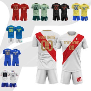 May include: A collection of soccer jerseys in various colors, including red, green, black, yellow, blue, and white. Each jersey features a team name and number, with matching shorts. The jerseys have different designs, some with stripes and others with solid colors.