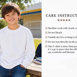 May include: A young person wearing a white crew neck sweatshirt and blue jeans. The image includes text that reads "CARE INSTRUCTIONS" and lists washing instructions. The person is standing outside near a wooden bench.