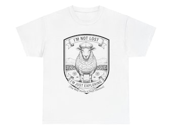 May include: White t-shirt with a black and white illustration of a sheep wearing a cap, inside a shield. Text reads "I'M NOT LOST, I'M JUST EXPLORING (The Way Home is Reyt Obvious)".