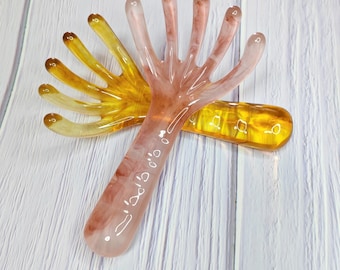 Peine de masaje meridiano con cabezal de cinco garras que le ofrece una experiencia de cuidado de la cabeza completamente nueva.