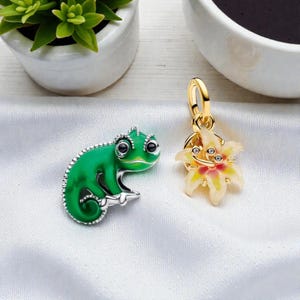 May include: A set of three ceramic mugs with a speckled, matte finish. The mugs are in shades of cream, light gray, and dark gray. Each mug has a simple, minimalist design and a rounded handle.