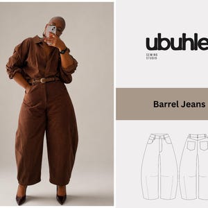 May include: A person in a brown outfit, comprising a collared shirt and wide-leg trousers, posing for a photo. The outfit is accessorized with a brown belt and dark shoes. The image also features a logo and the text "Barrel Jeans".
