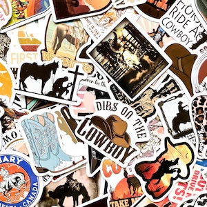 May include: A collection of cowboy-themed stickers featuring images of horses, cowboy hats, and rodeo scenes. The stickers have various colors, including brown, blue, and orange, with text like "Cowboy" and "Dibs on the Cowboy".