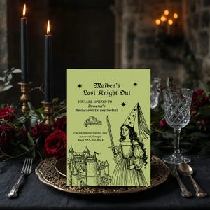 May include: A green invitation card with the text "Maiden's Last Knight Out" and a drawing of a woman in a wizard hat holding a sword. The card is on a table set with candles, roses, and a decorative plate.