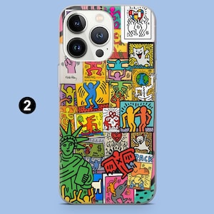 May include: A clear phone case with a vibrant pop art collage. The design includes illustrations of the Statue of Liberty, dancing figures, and the text "HARING POSTERS". The artwork is in bright, eye-catching colours.