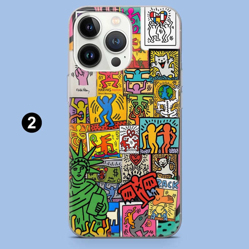 May include: A clear phone case with a vibrant pop art collage. The design includes illustrations of the Statue of Liberty, dancing figures, and the text "HARING POSTERS". The artwork is in bright, eye-catching colours.