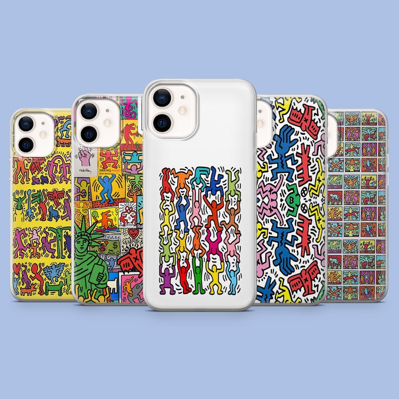 May include: Five phone cases with vibrant, abstract designs. The cases display diverse patterns, including figures, shapes, and the Statue of Liberty. The cases are arranged in a row against a light blue backdrop.