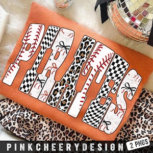 May include: An orange t-shirt with the word "PIRATES" in a baseball bat design. The letters feature baseballs, black and white checkered patterns, and leopard print. The text "PINKCHEERYDESIGN 2 PNGS" is at the bottom.