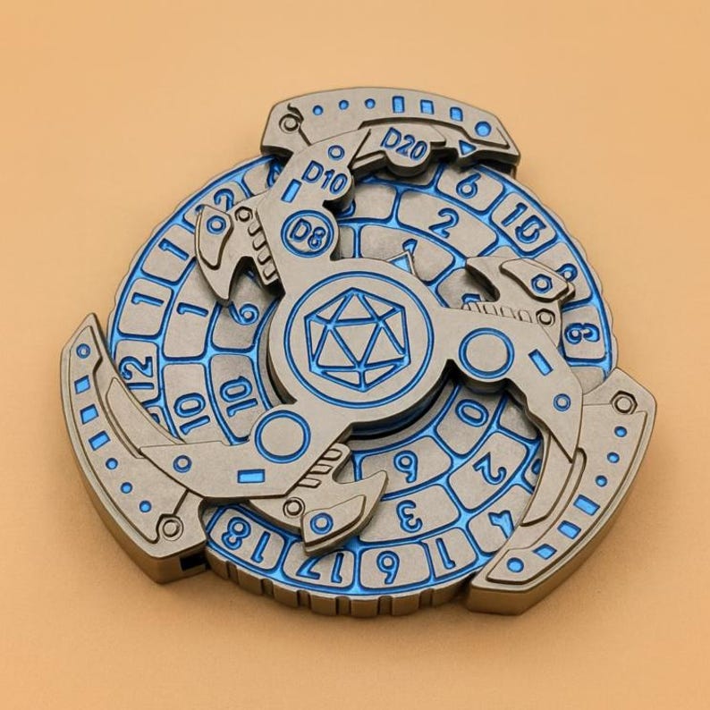 May include: A metallic fidget spinner with blue accents and engraved numbers. The center features a geometric design, and the edges display D8, D10, and D20 markings. A unique item for tabletop gaming enthusiasts.