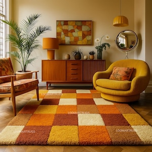May include: A retro-style living room featuring a geometric patterned rug in shades of orange, yellow, and cream. The room includes a mustard yellow armchair, a wooden cabinet, and a matching lamp. The text "LOOMARTRUGS" is visible on the rug.