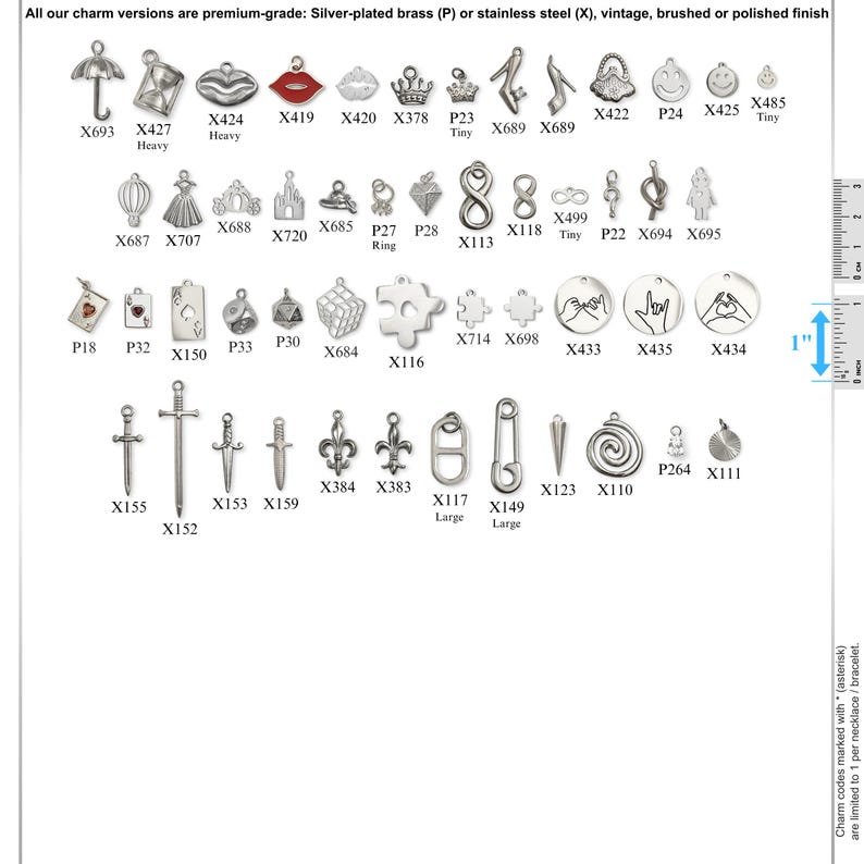 May include: A collection of silver-toned metal charms in various shapes including umbrellas, crowns, swords, and symbols, labeled with alphanumeric codes. A vertical ruler on the right side indicates a 1-inch scale for size reference.