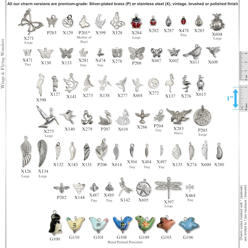 May include: A collection of metal charms in various shapes including butterflies, birds, insects, and wings, labeled with alphanumeric codes. A visible 1-inch ruler indicates scale. The bottom row features hand-painted porcelain animal charms.