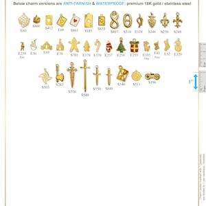 May include: A collection of gold-colored charms in various shapes, including hearts, playing cards, and holiday-themed designs. The charms are labeled with codes and are made of 18K gold or stainless steel. The image includes a ruler for size reference.