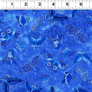 May include: Blue fabric with a repeating pattern of blue butterflies. The butterflies are stylized and have intricate details. The background is a light blue with a watercolor effect.