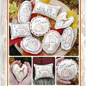 May include: A promotional image for "Hudson's Holidays" featuring eight embroidered designs, including pumpkins, turkeys, and pilgrims. The text "Give Thanks" is at the top. These ornaments and bowl fillers are designed for quick stitching.