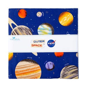 May include: A stack of square fabric pieces with a blue background and colorful illustrations of planets. The fabric features planets like Saturn, Jupiter, and Venus, with the words "Outer Space" and the NASA logo.