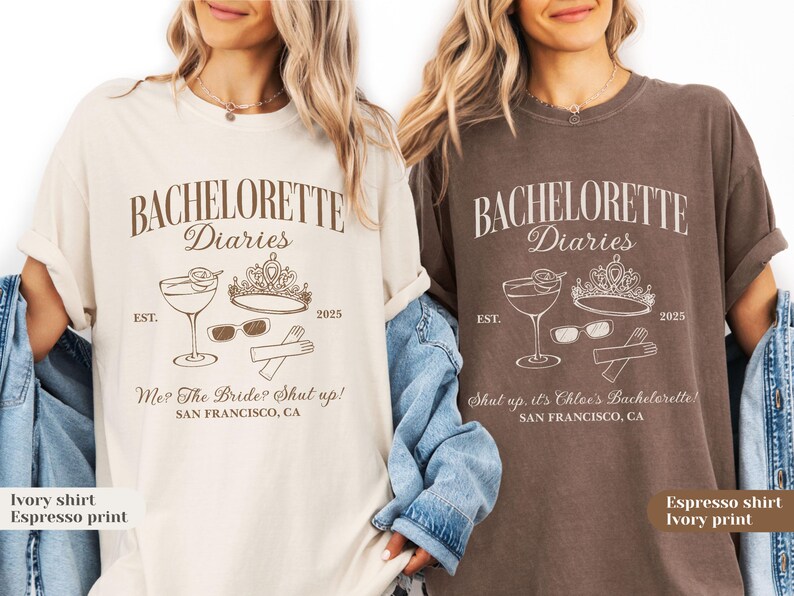 May include: Two t-shirts, one ivory and one espresso, feature the text "BACHELORETTE Diaries" with a cocktail, crown, sunglasses, and utensils graphic. The ivory shirt says "Me? The Bride? Shut up!" and the espresso shirt says "Shut up. it's Chloe's Bachelorette!"