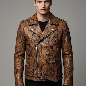 May include: Brown snakeskin-patterned leather jacket with a notched collar, asymmetrical zipper closure, and multiple zippered pockets. The jacket features a belt at the waist and silver hardware. A stylish outerwear piece.