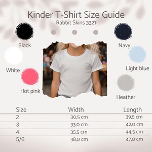 May include: A white t-shirt on a child, part of a size guide for Rabbit Skins 3321 shirts. The guide includes colour swatches in black, white, hot pink, navy, light blue, and heather. Measurements are provided in centimetres for sizes 2, 3, 4, and 5/6.