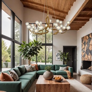 May include: A modern living room with a large green sectional sofa, a wooden coffee table, and a decorative chandelier. The chandelier has a gold-colored frame with multiple glass globe lights. Large windows offer a view of the outdoors.