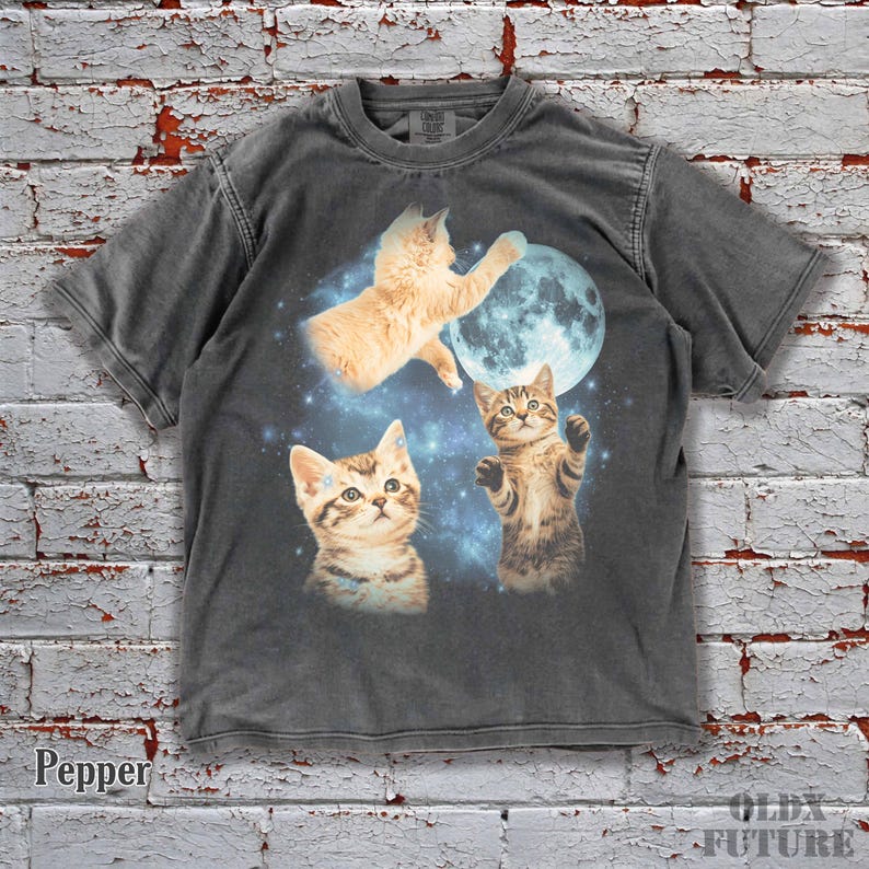 🐾 Step into the cosmic vibe with this Vintage Moon Cat Shirt! Featuring adorable kittens reaching for the moon, this oversized washed tee brings 90s nostalgia and dreamy comfort together. Perfect for cat lovers who enjoy a funny, retro, and aesthetic look. Add this vintage Comfort Colors tee to your cart today and stand out in style! 🌙✨