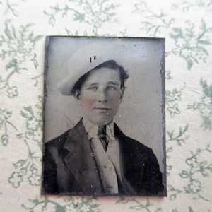 antique miniature gem tintype photo - 1800s, young smiling man with white hat, tinted cheeks