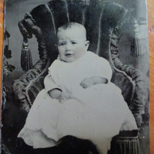 antique tintype photo - 1800s, cute baby sitting in baby sized velvet chair