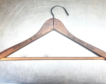 Vintage Wooden Hanger with advertising from McManus & Riley Albany NY