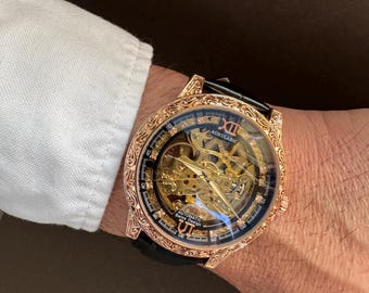 Luxury Gold Skeleton Mechanical Watch: Engraved Case, Black Leather Strap