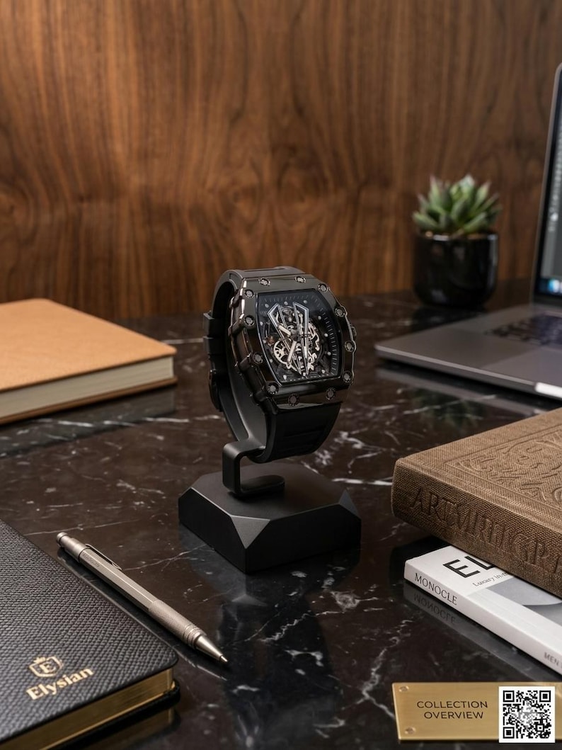 May include: A black wristwatch with a skeleton dial is displayed on a black stand. The watch has a black strap and a complex internal mechanism visible through the face. The watch is on a black marble surface.