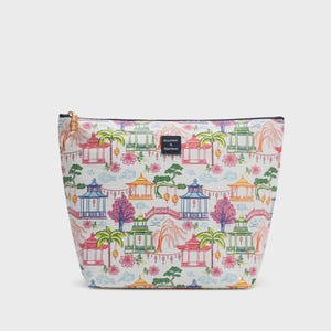 May include: White cosmetic bag with a colorful Asian-inspired pattern featuring pagodas, trees, and flowers. The bag has a black zipper and a bamboo pull. The text "Bourbon & Bamboo" is visible on the bag.