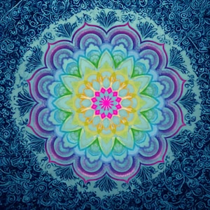 May include: A circular mandala design featuring a vibrant central star in hot pink, surrounded by layers of yellow, light green, and soft blue petals. The outer border consists of intricate purple and blue swirling patterns on a dark blue background.