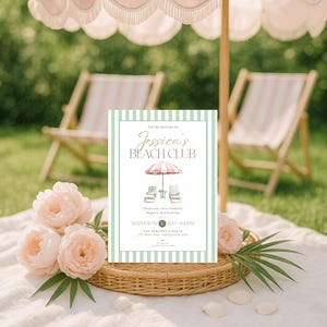 May include: A beach club invitation with a striped border and the text "Jessica's Beach Club". The invitation features illustrations of a beach umbrella and chairs. The scene includes pink roses, a woven basket, and beach chairs.