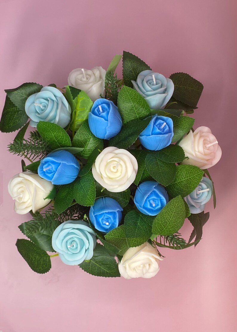 May include: A white ceramic mug with a black handle and the text "But First, Coffee" in a black, bold font. The mug is on a white surface.