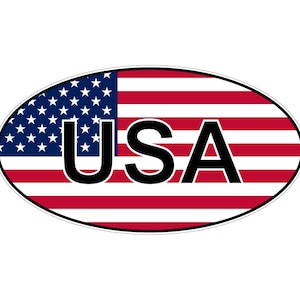 May include: An oval-shaped sticker featuring the flag of the United States of America with horizontal red and white stripes and a blue canton with white stars. The letters USA are printed in a bold, black, sans-serif font across the centre.