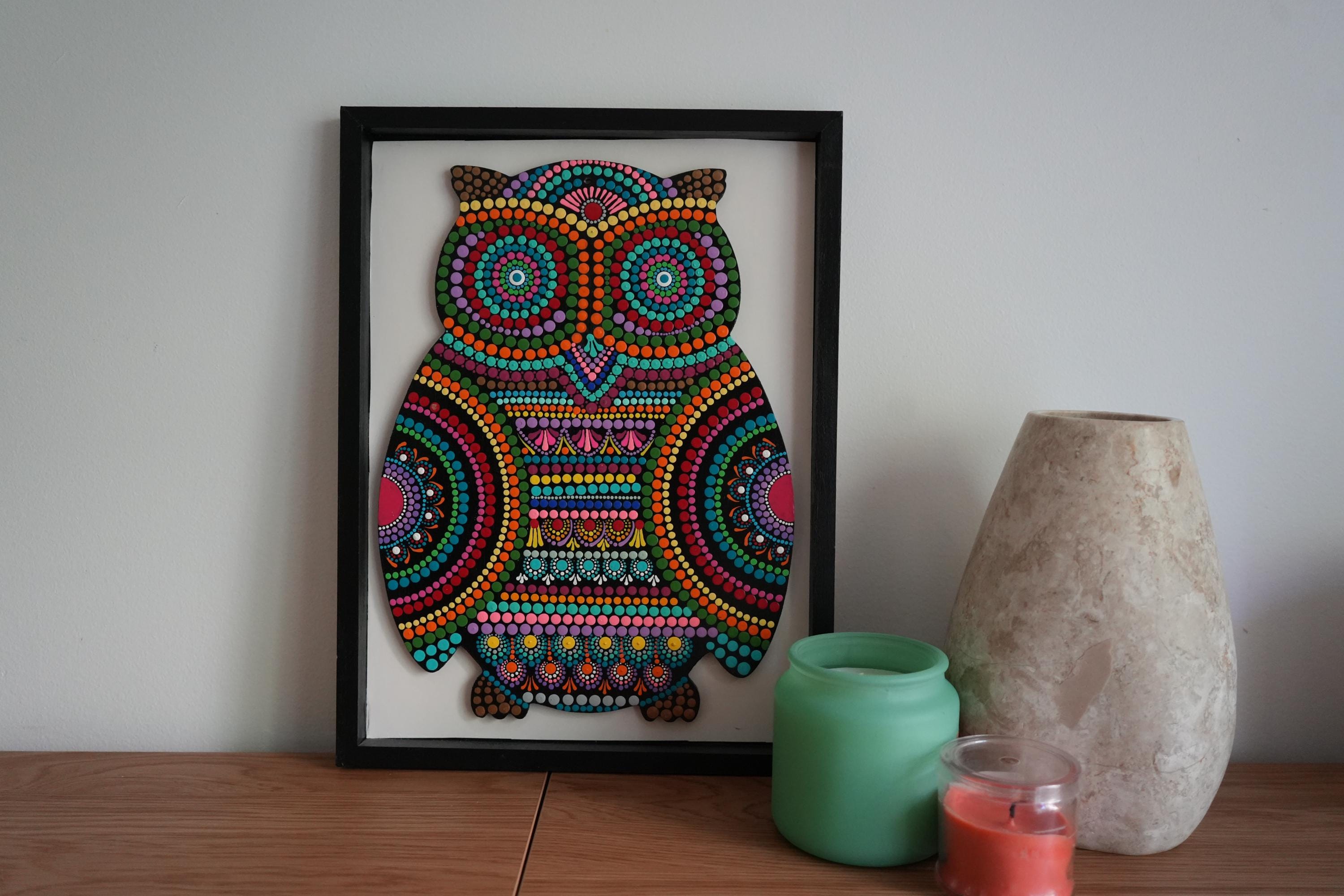 Handcrafted owl dot art in an open shadow box frame