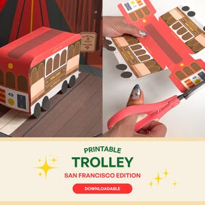 May include: A red and brown paper trolley model with the words "Ding Ding" on the side. The model is on a brown surface. The image also shows the flat, unfolded trolley design and a pair of pink scissors.