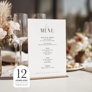 May include: A white vertical bar menu card with black serif typography, featuring sections for signature drinks, beer, wine, and spirits, with the text James & Olivia and 12 Templates Mojave Suite, standing on a thin gold metal base.