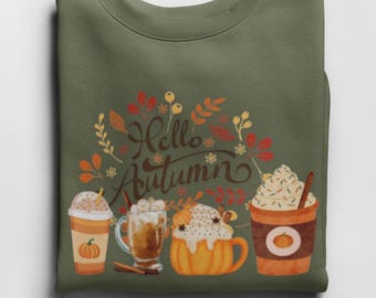 May include: An olive green sweatshirt featuring a "Hello Autumn" design. The design includes four different coffee drinks with whipped cream and cinnamon sticks, and a fall-themed floral arrangement.