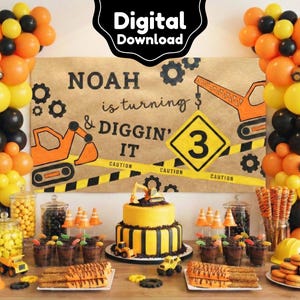 May include: A construction-themed birthday party setup with balloons, a cake, and treats. The backdrop reads "NOAH is turning & DIGGIN' IT" with a number 3 sign. Orange, yellow, and black are the dominant colors, with toy construction vehicles.