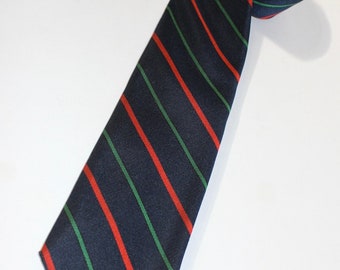 vintage 70's - 80's -Reis of New Haven- Men's neck tie. Navy Blue with repeating Red and Green bar stripes. 3 1/4" width.