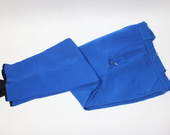 vintage 1960's -unlabeled- Men's ski pants. NOS? Medium Blue  - Synthetic knit. Zippered pockets, tunnel belt loops, stirrups. 32" Waist