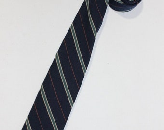 vintage 1960's -Ferrell Reed Ltd- Men's narrow neck tie. Silk / Wool blend - Woven in England. Diagonal stripe on Navy Blue. 2 1/2" wide.