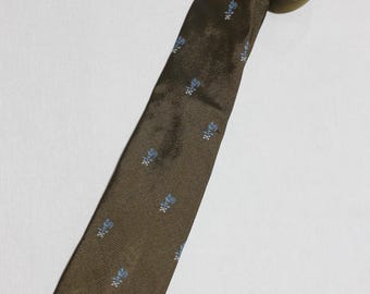 vintage 1960's -Wembley- Men's 'Wemlon' neck tie. Jacquard woven emblem - 'Rooster weathervane'. Olive Green field. Poly Repp. 2 5/8" wide
