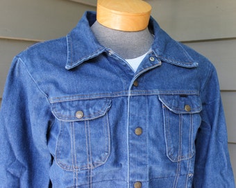 vintage 1960's Men's 4 pocket denim jacket by KEY.  Action back - Side buckle adjustment.  Washed & worn to perfection. Size 42